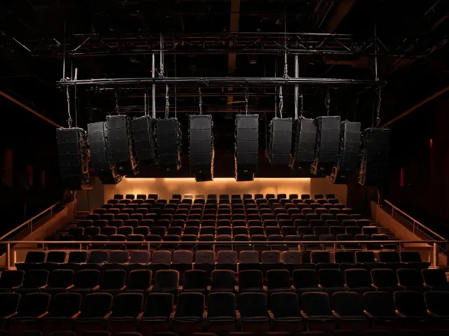 Line array flown in a theater balcony