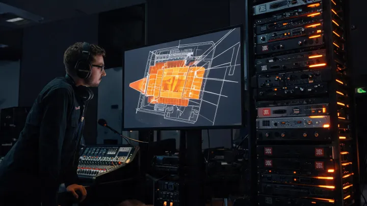 Engineer reviewing JBL Professional venue audio coverage plan